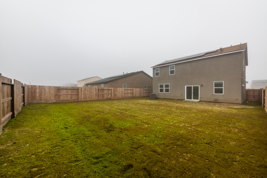 A house with a fence around it.