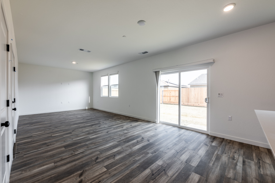 A room with a wood floor and a wood floor.