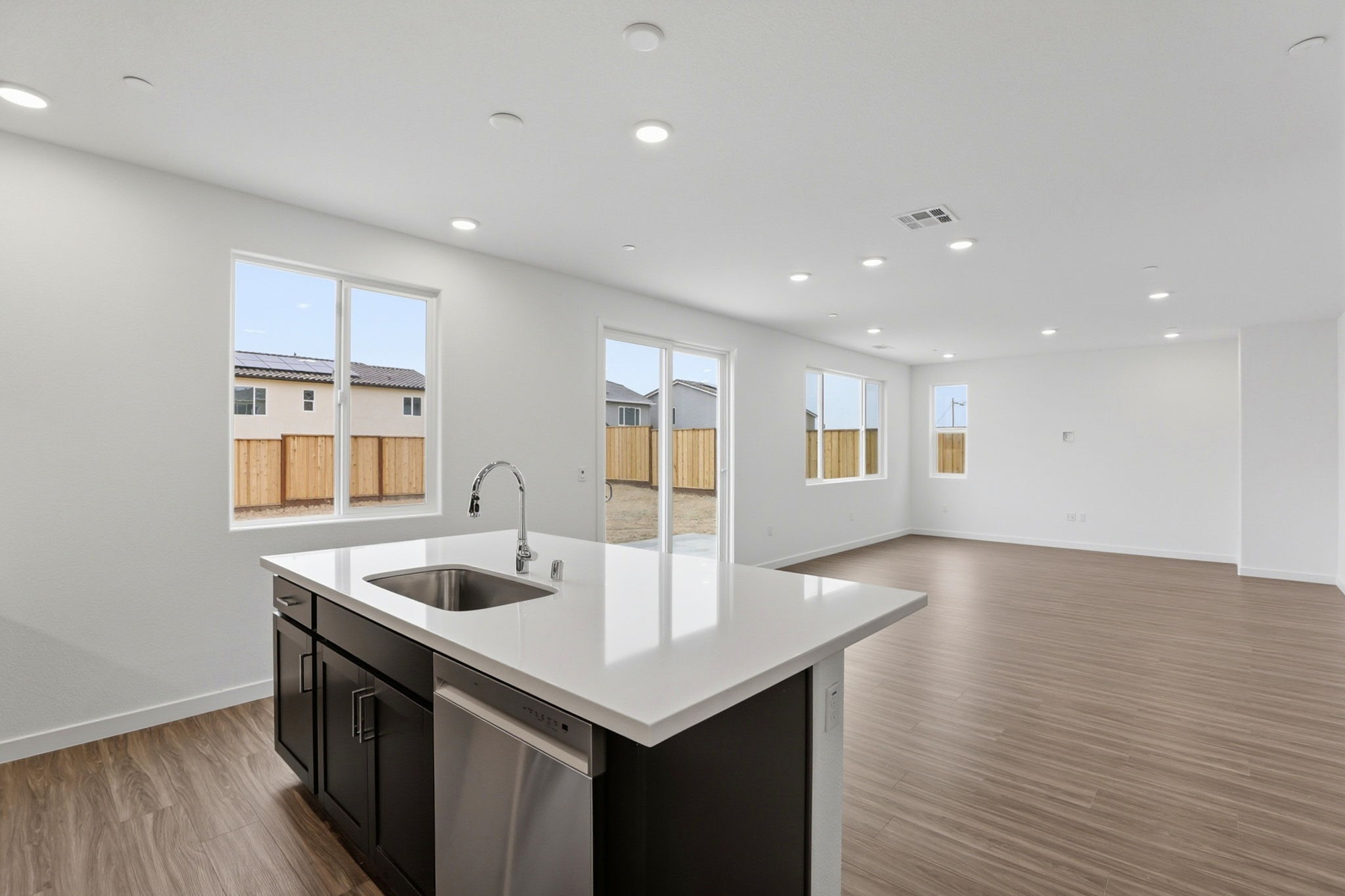 A kitchen with a sink and cabinets.