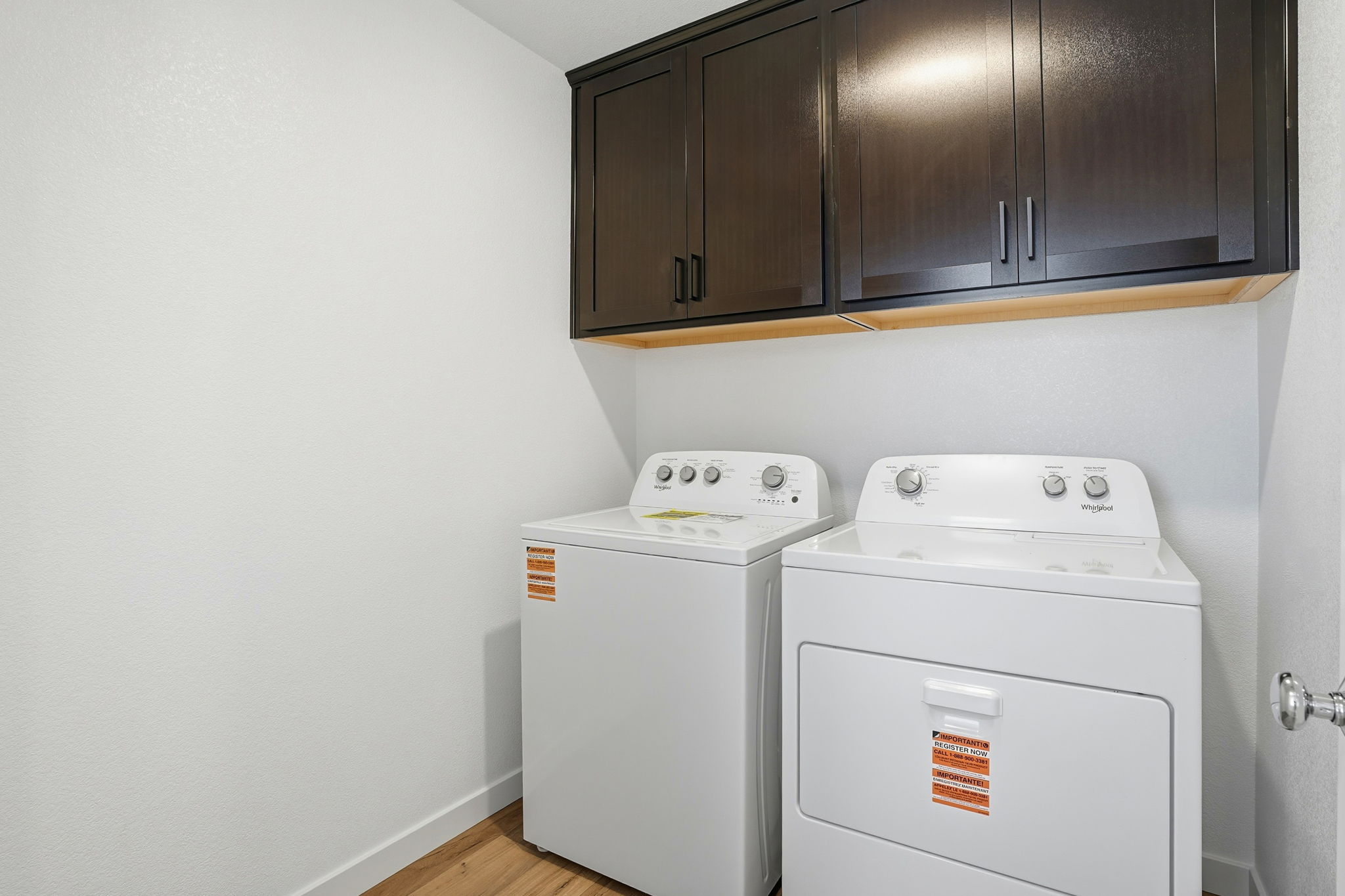 A white washing machine in a room.