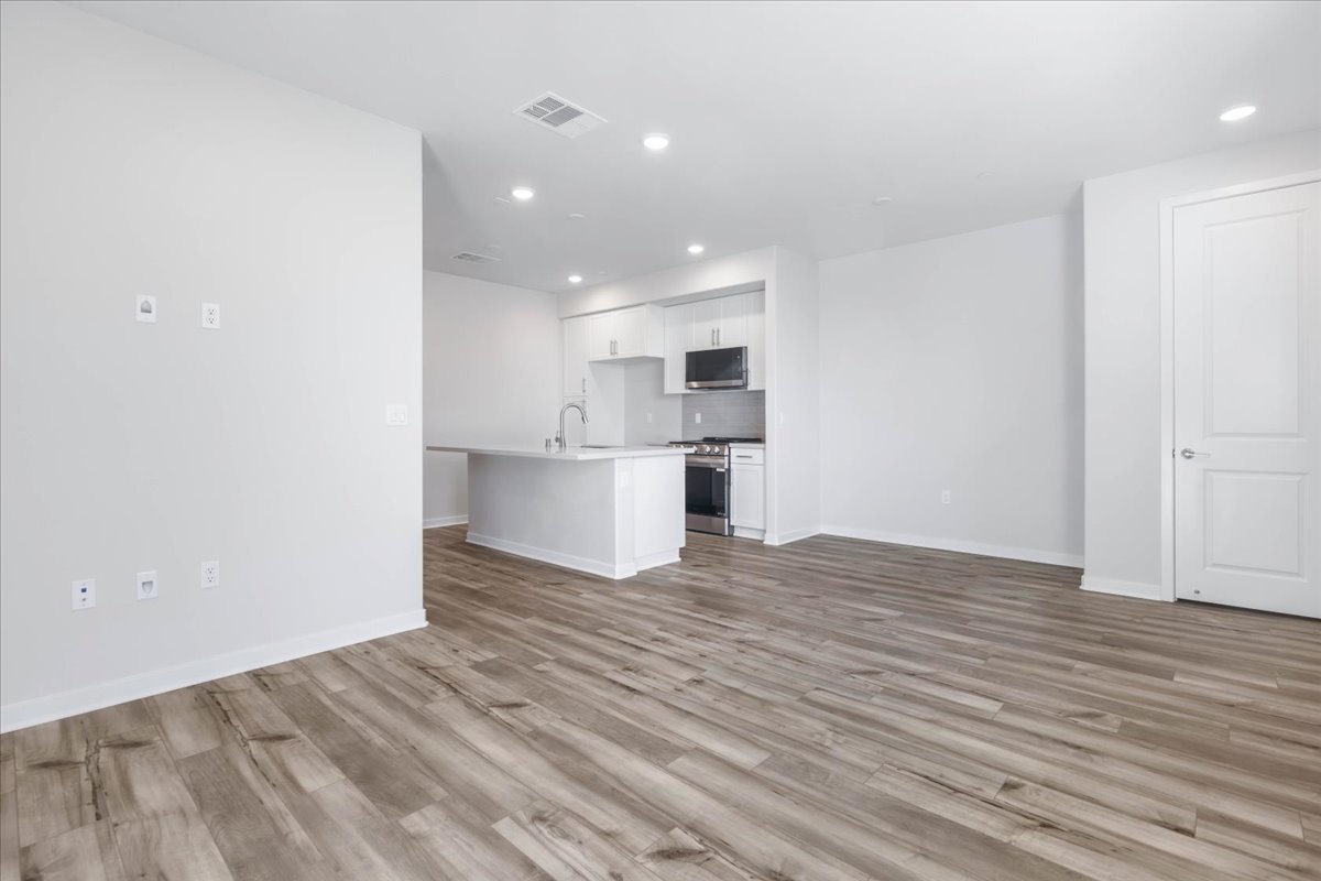 A kitchen with white walls.