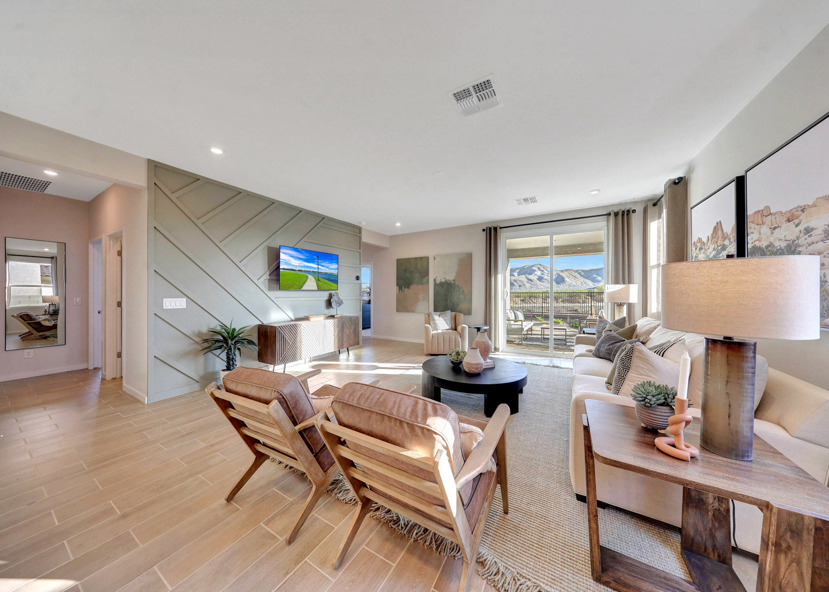 A living room with a wood floor.