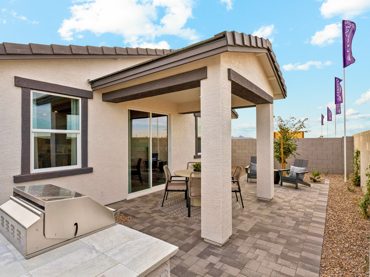 A building with a stone patio and a stone patio with a stone patio.