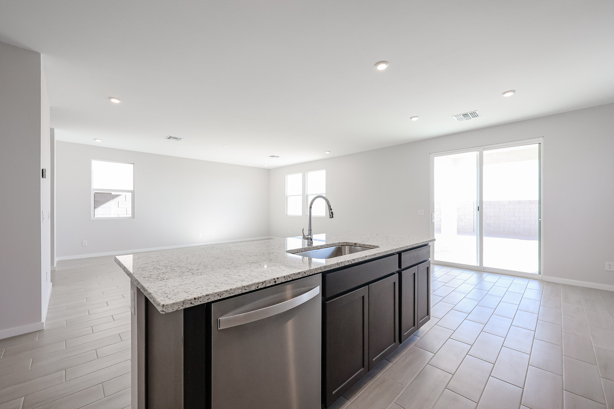 A kitchen with a marble countertop.