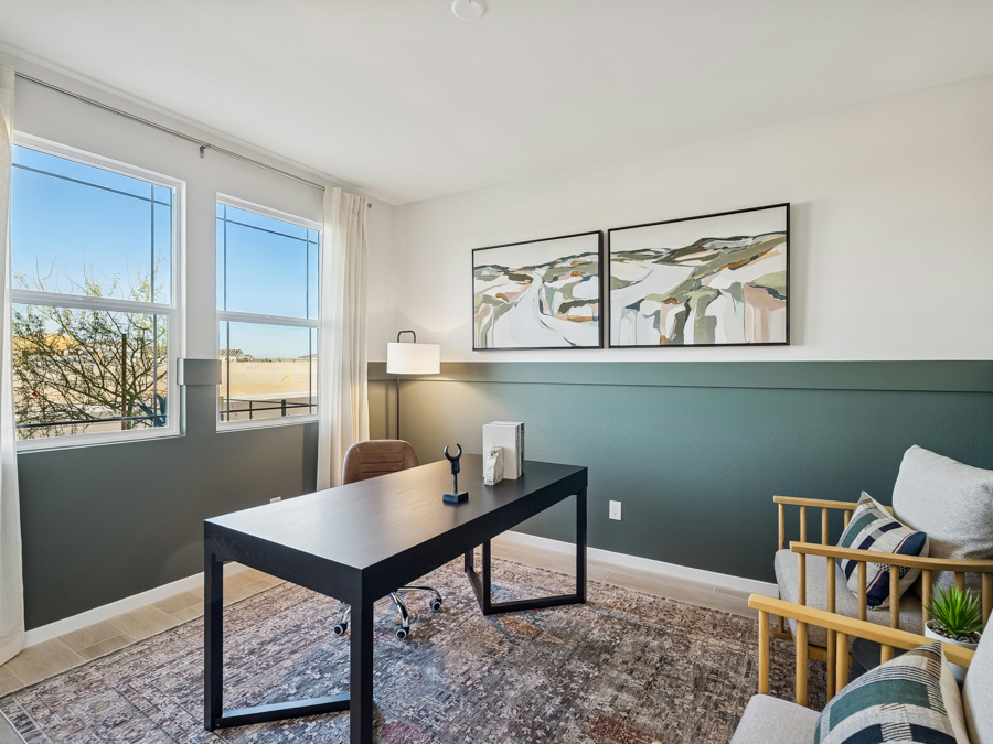 A room with a table and chairs.