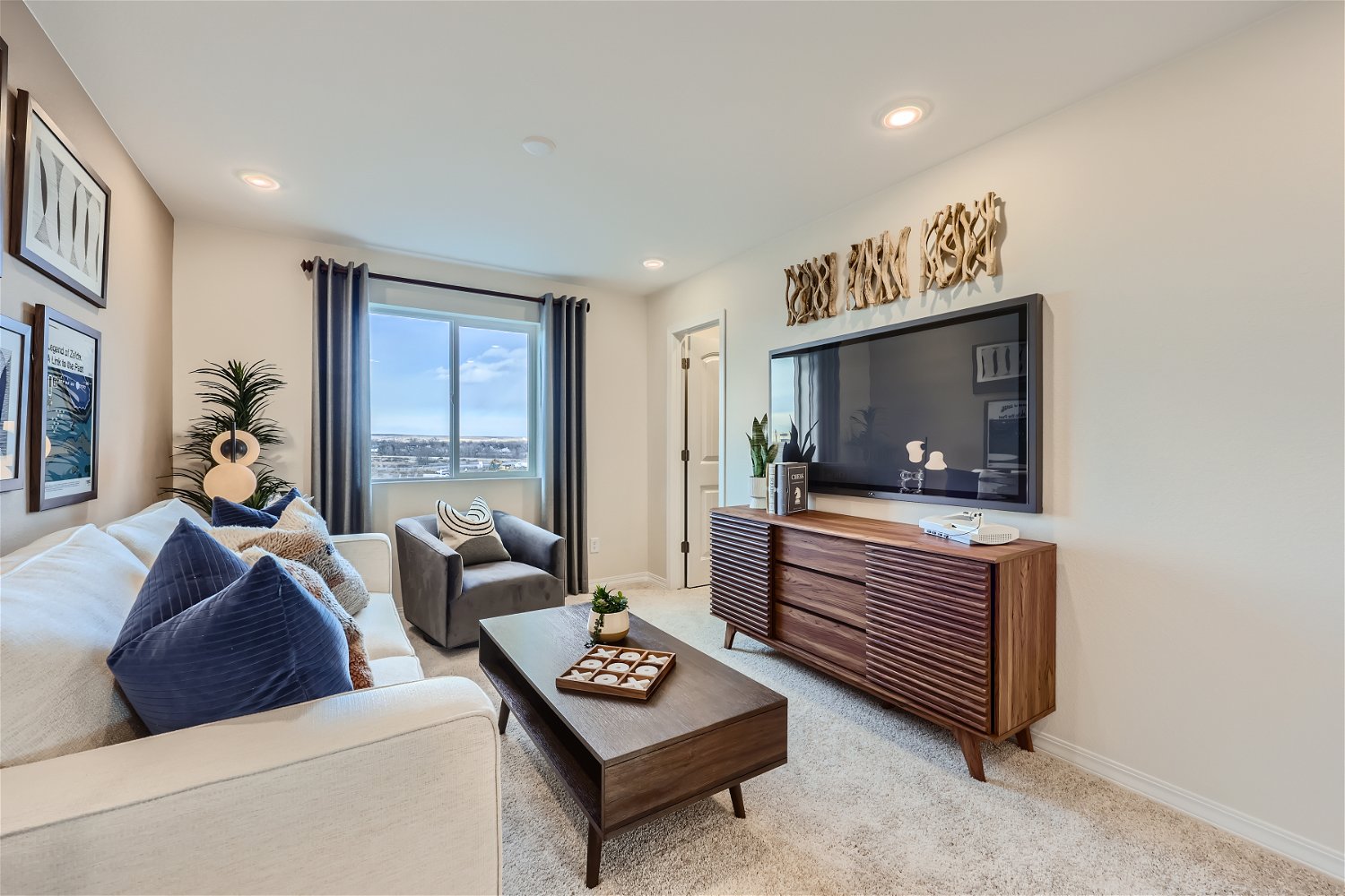 A living room with a tv and couches.