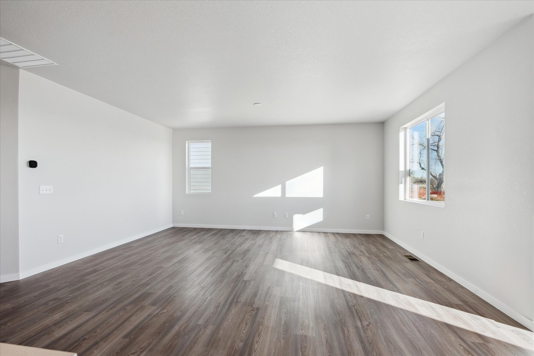 A room with a wood floor and a wood floor.