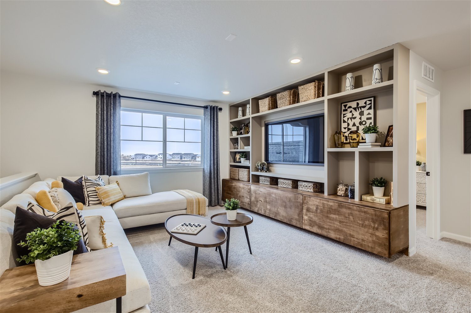 A living room with a tv and a couch.