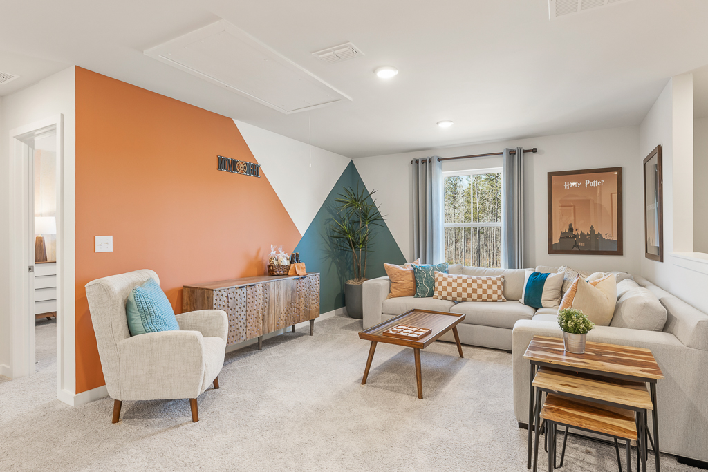A living room with a couch and a table.