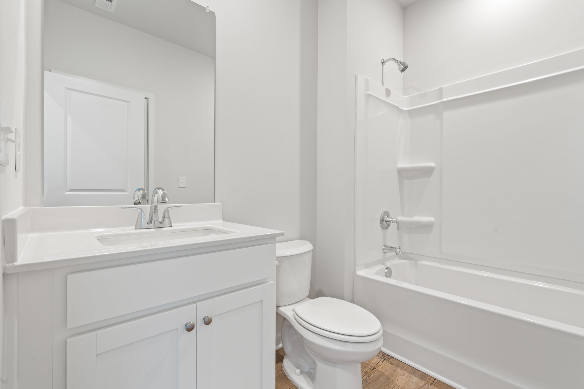A bathroom with a toilet and sink.