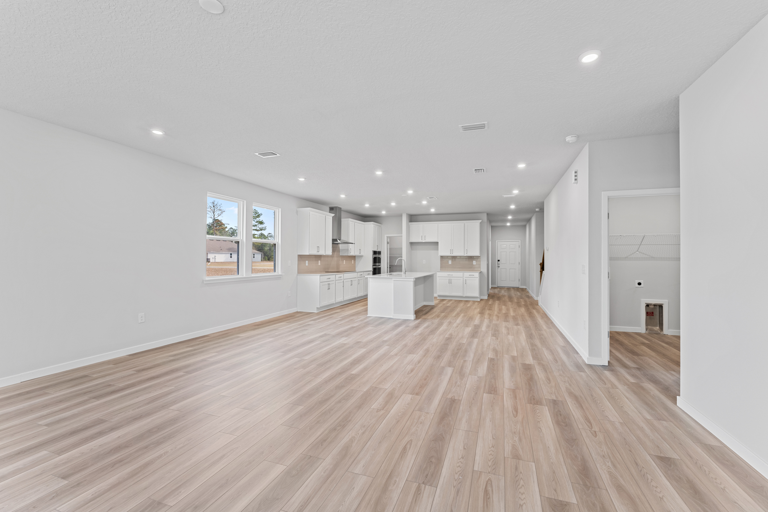 Lot 533 Open Living Area with Kitchen in Back at NorthShore