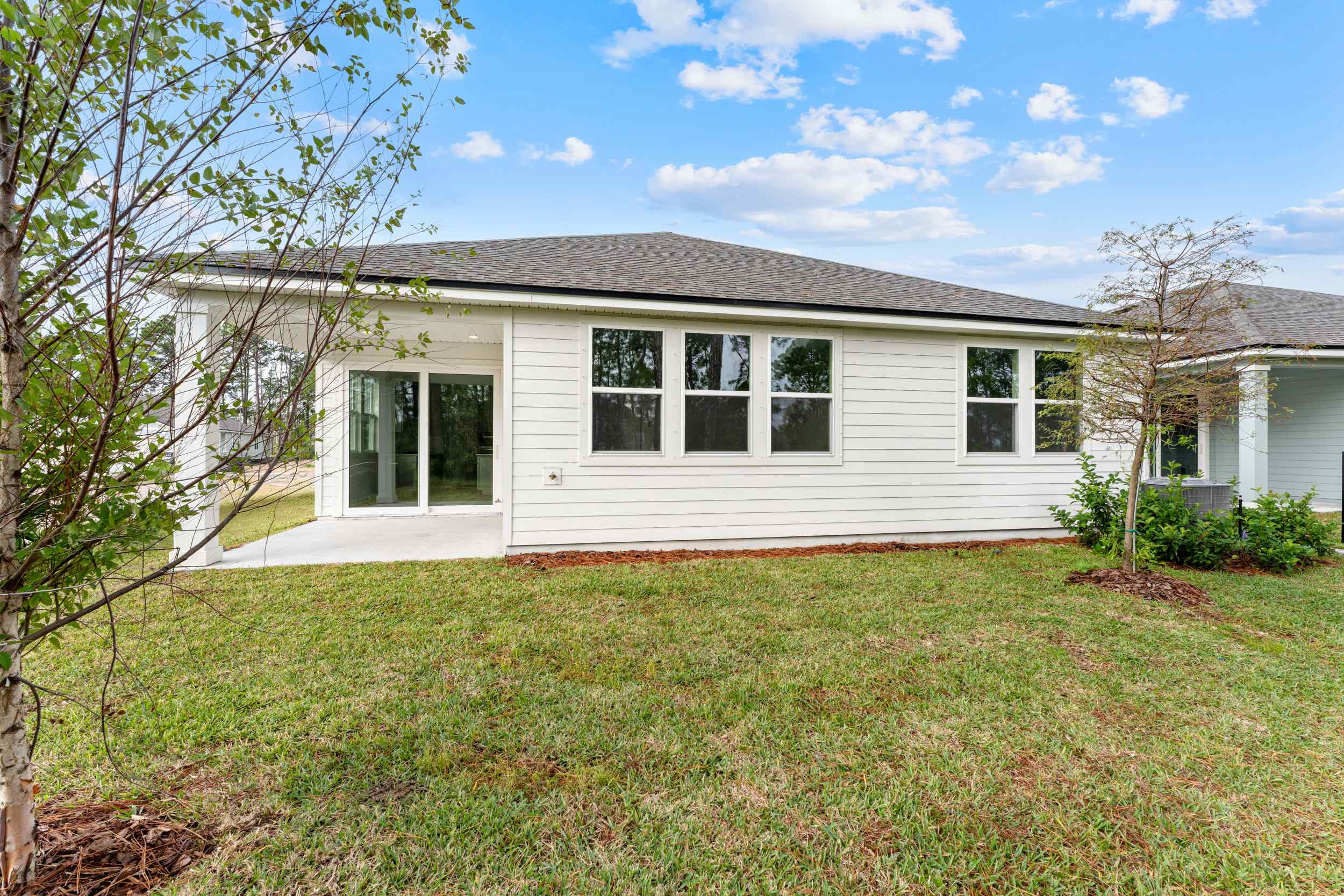 Lot 212 Rear Exterior with covered Patio at Reserve East in Flagler Beach