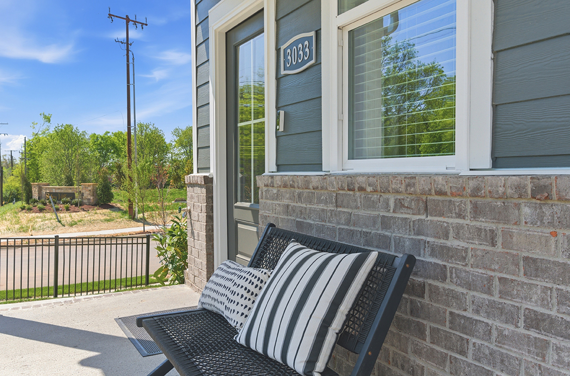 A bench sits outside a building.