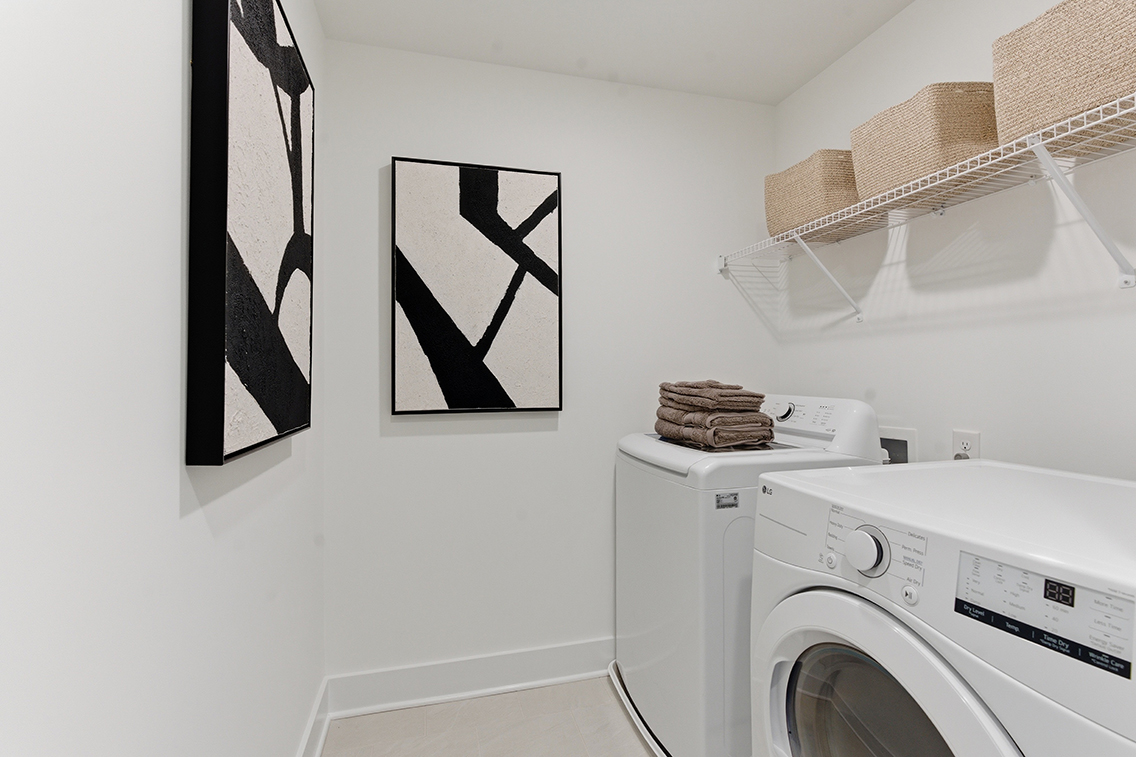 A laundry room with a washer and dryer.