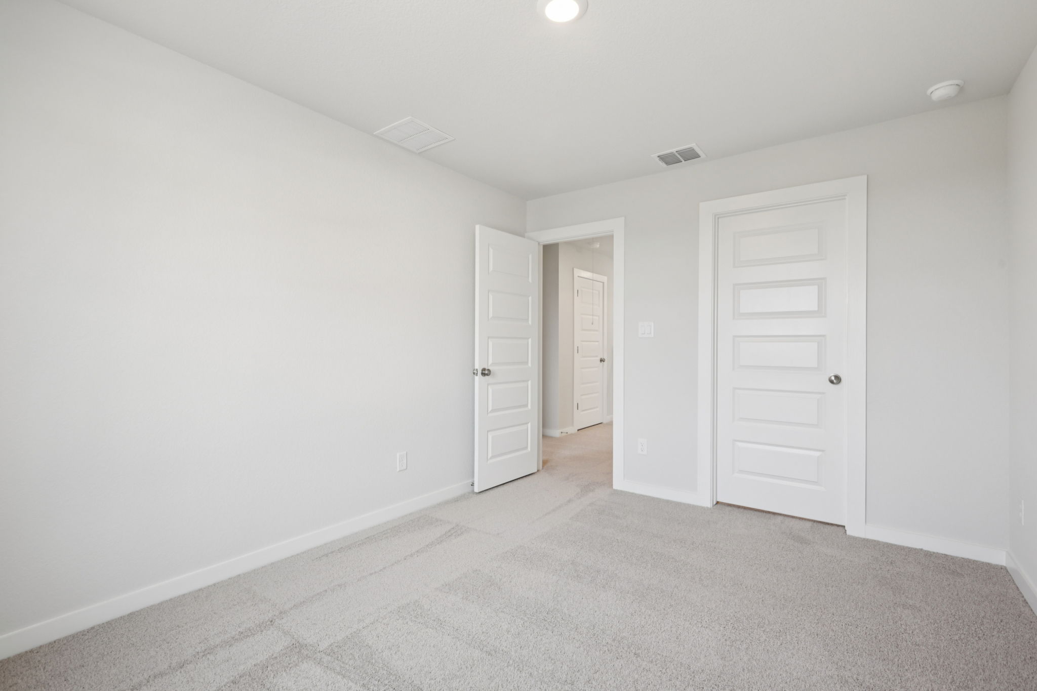 A room with white doors.