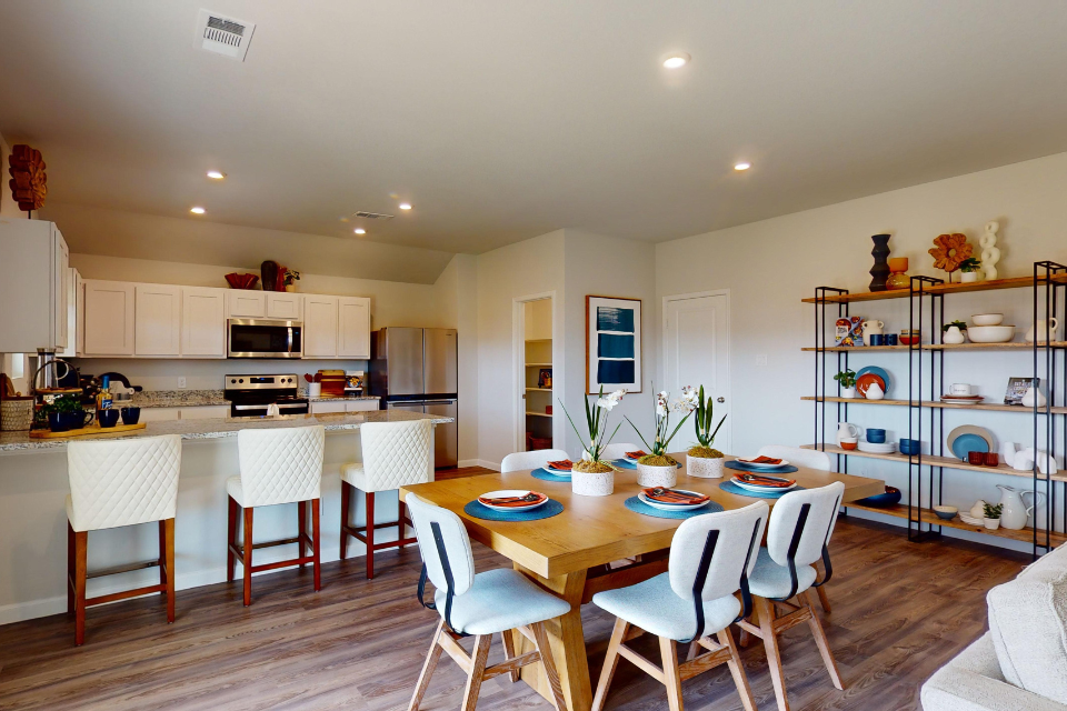 A kitchen with a dining table.