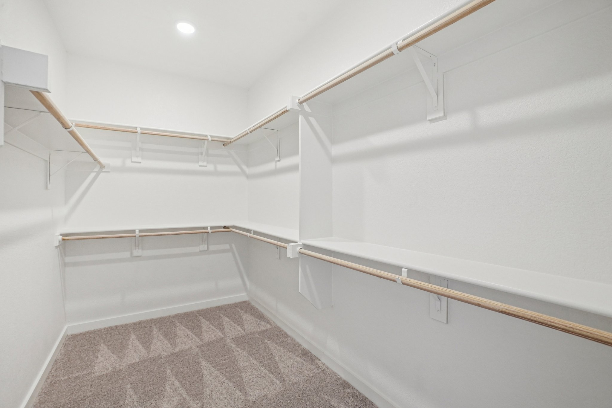 A white staircase in a room.