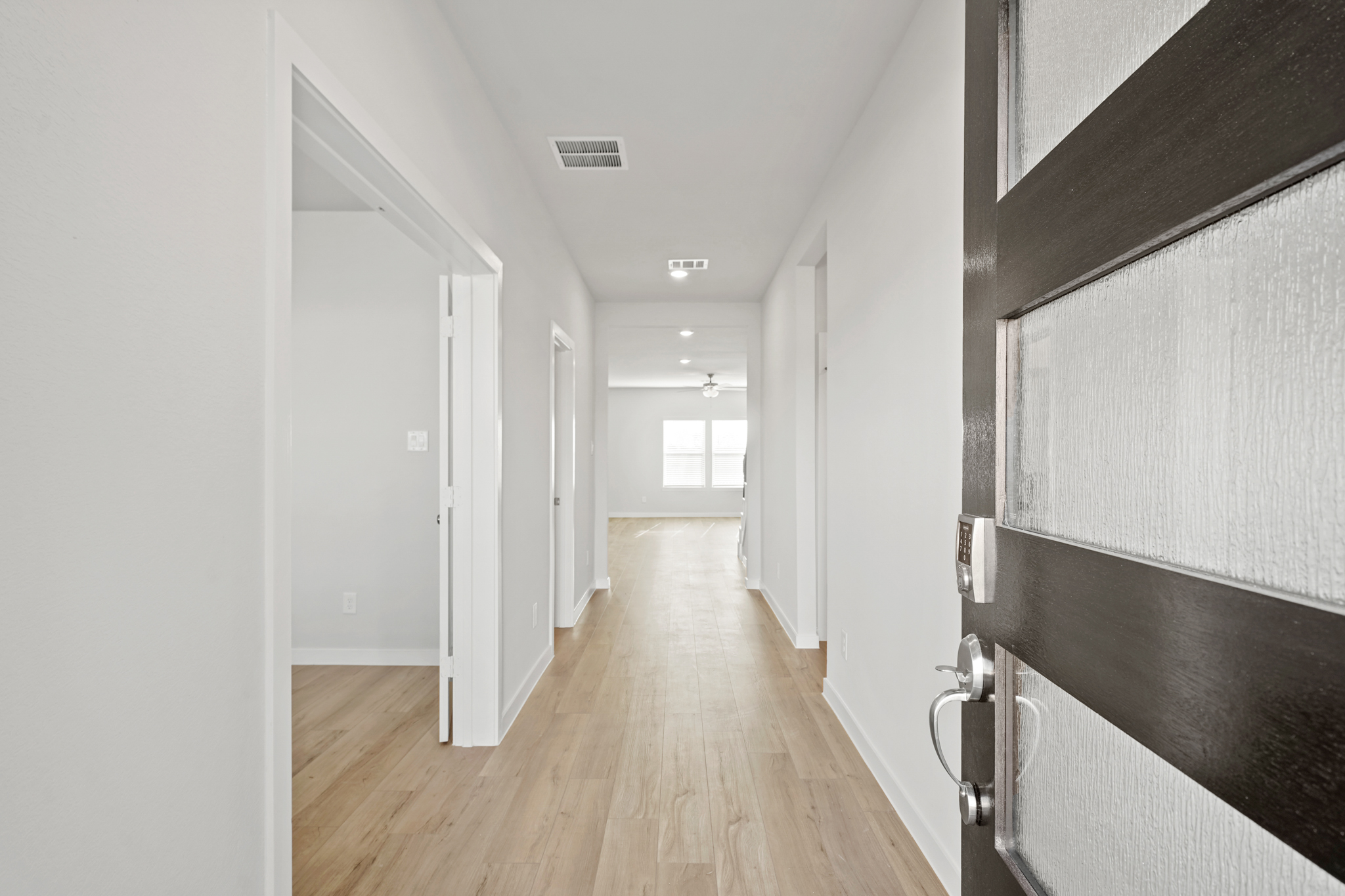 A hallway with white walls.