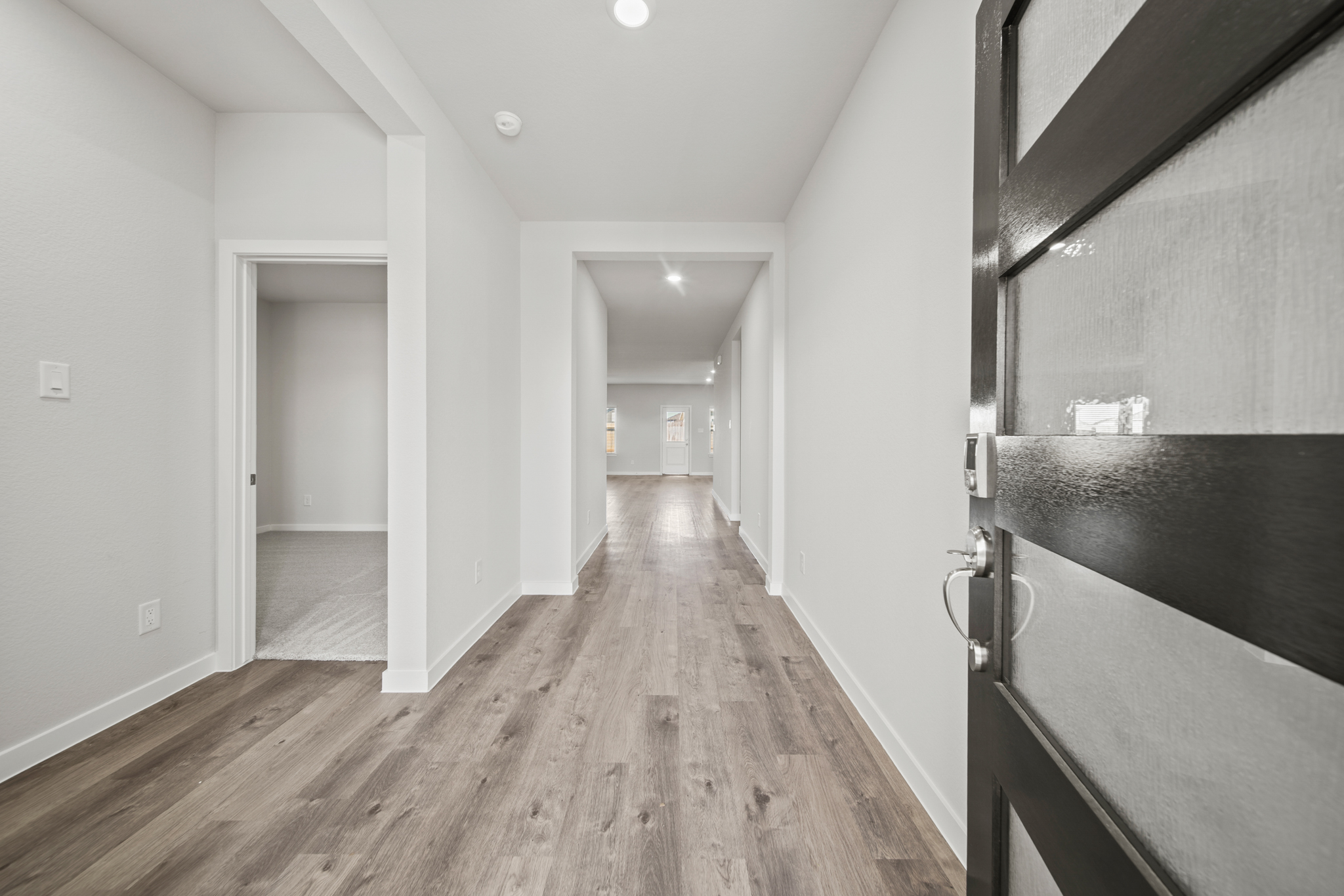 A bathroom with a wood floor.