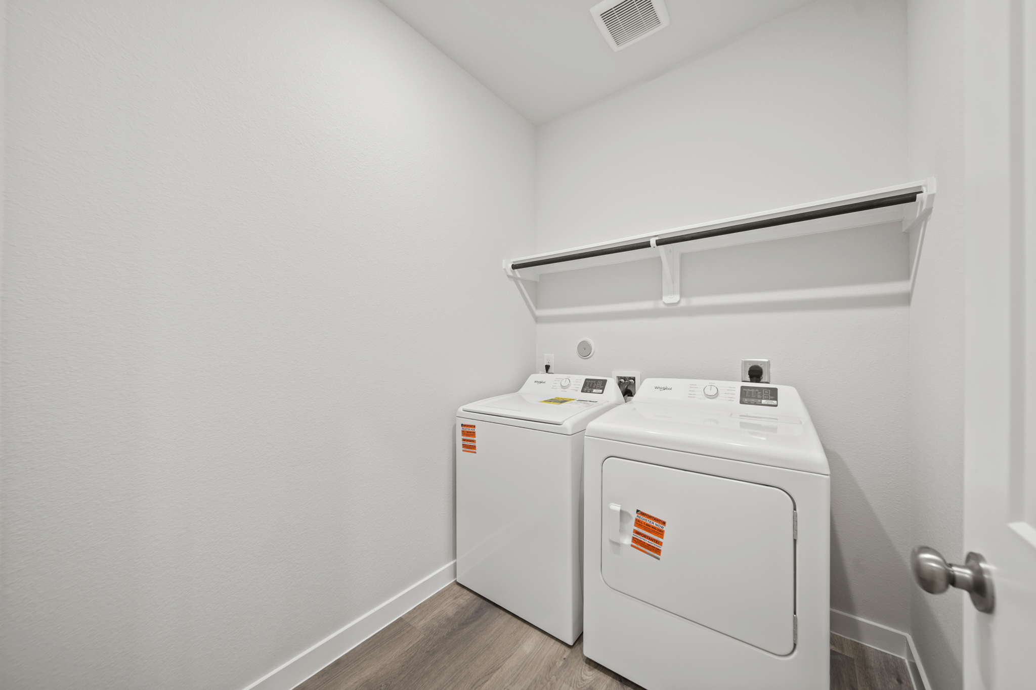 A white washing machine in a room.