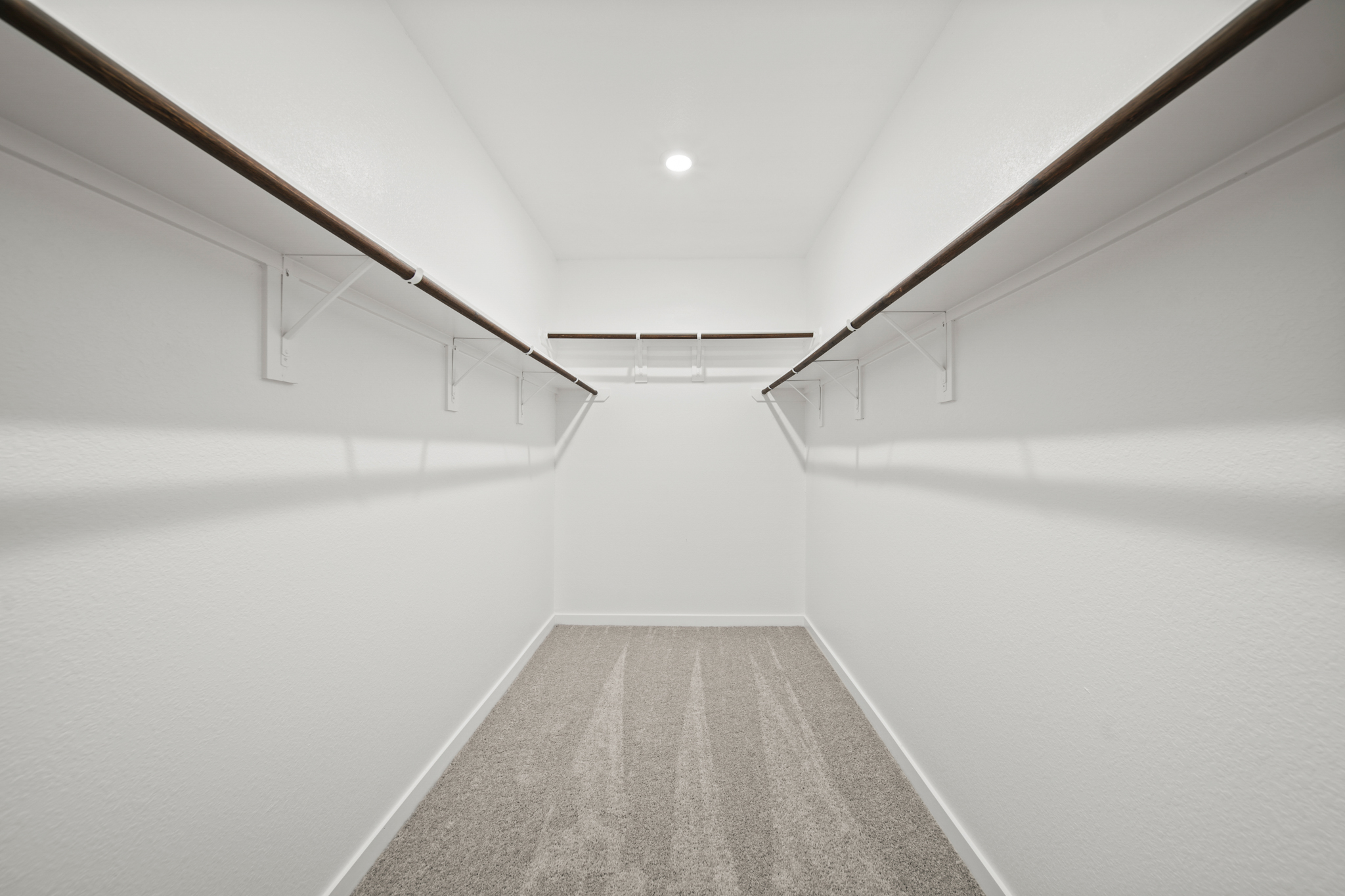 A hallway with white walls.