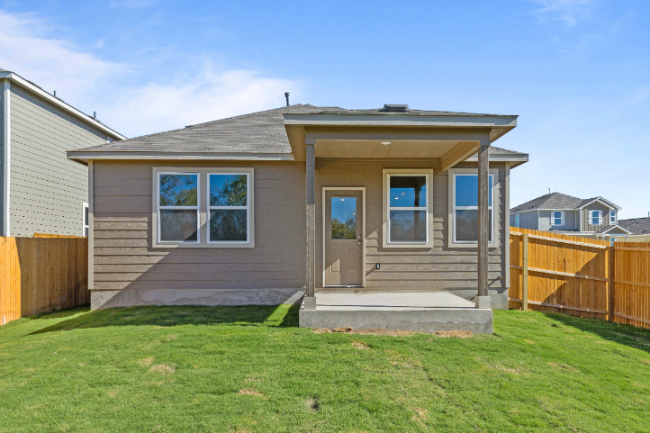 A small house with a fence.