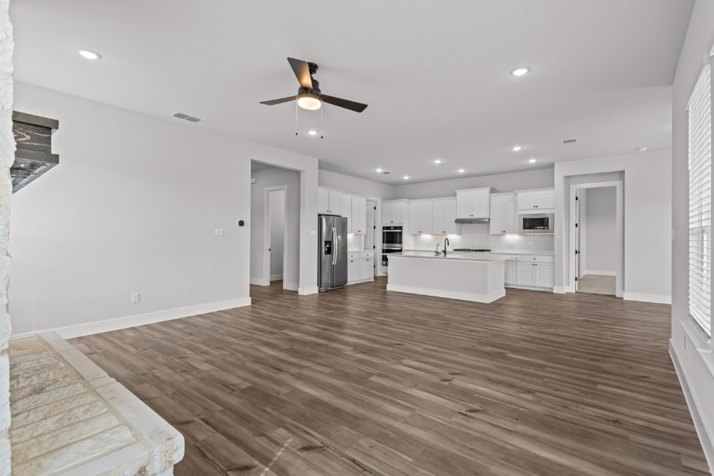A large kitchen with white cabinets.
