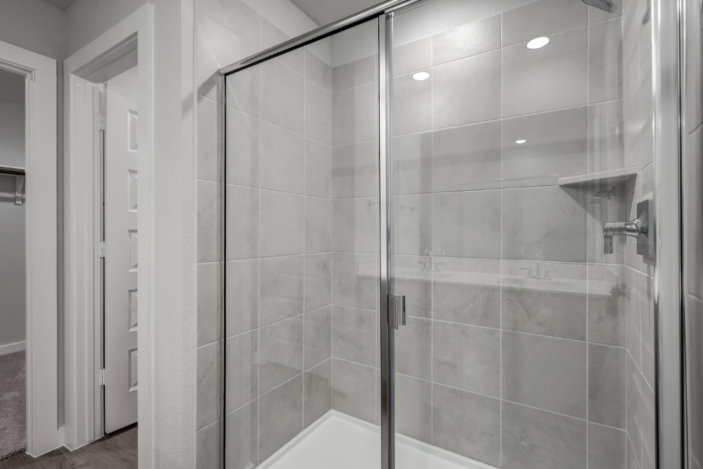 A shower with glass doors.