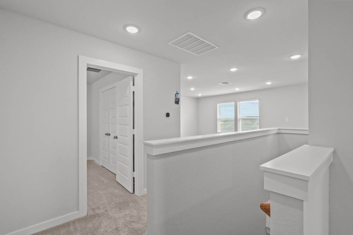 A bathroom with white walls.