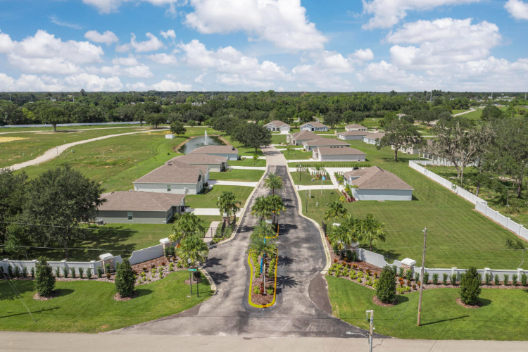 A park with a path and trees.