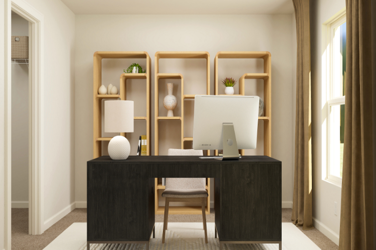 A room with a desk and a computer.