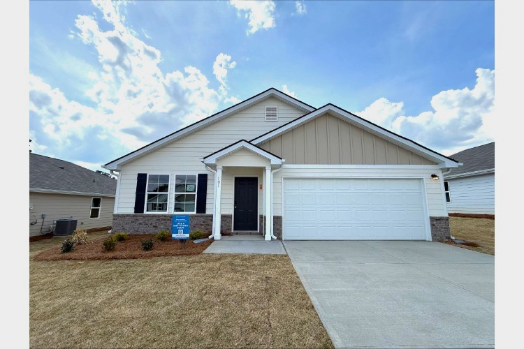 A house with garages and a driveway.
