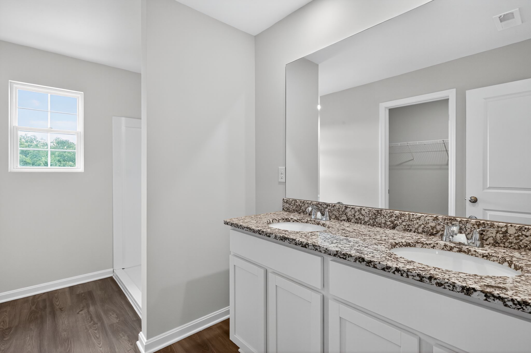 A bathroom with a marble countertop.