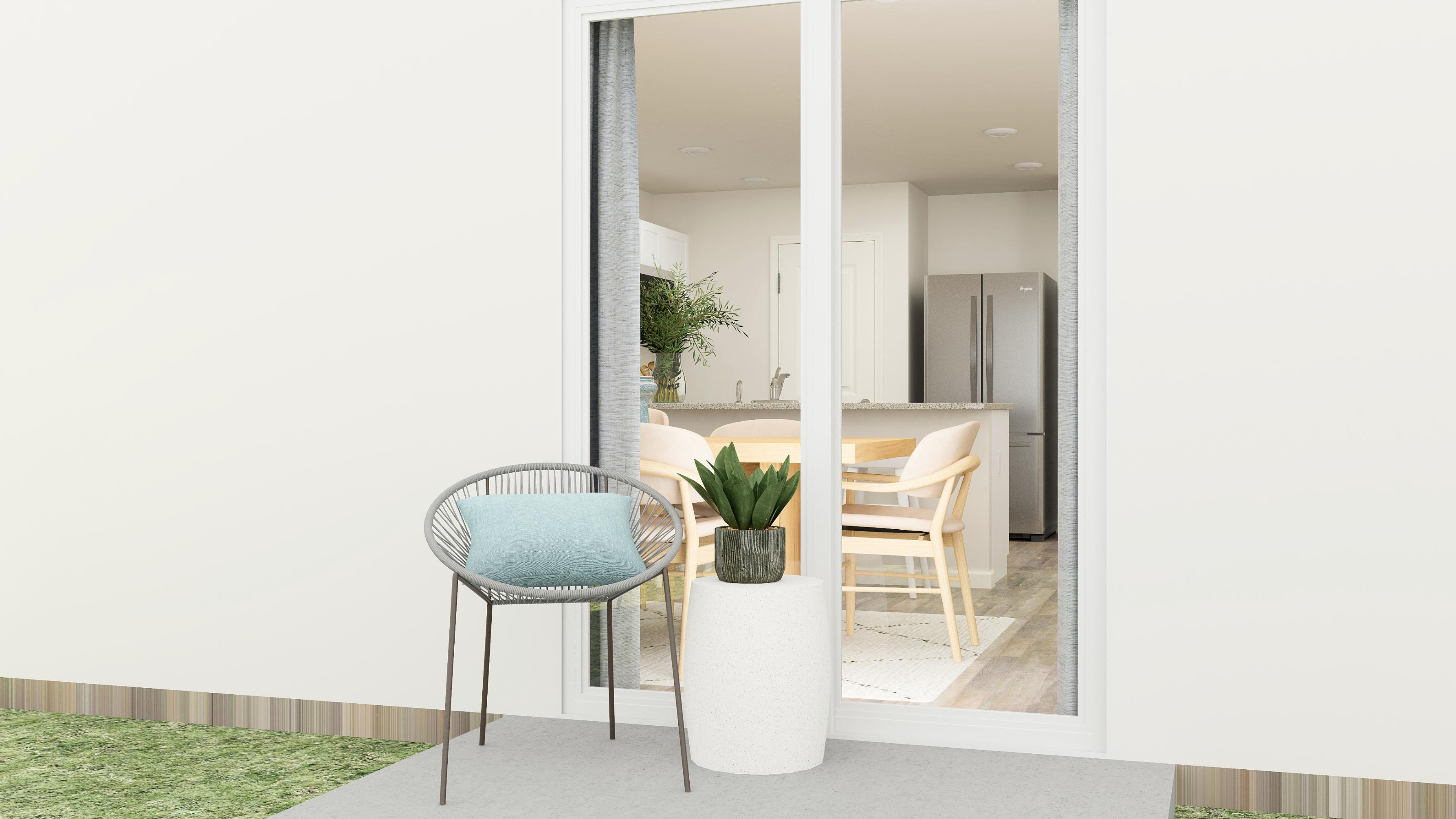 A room with a table chairs and a plant in it.