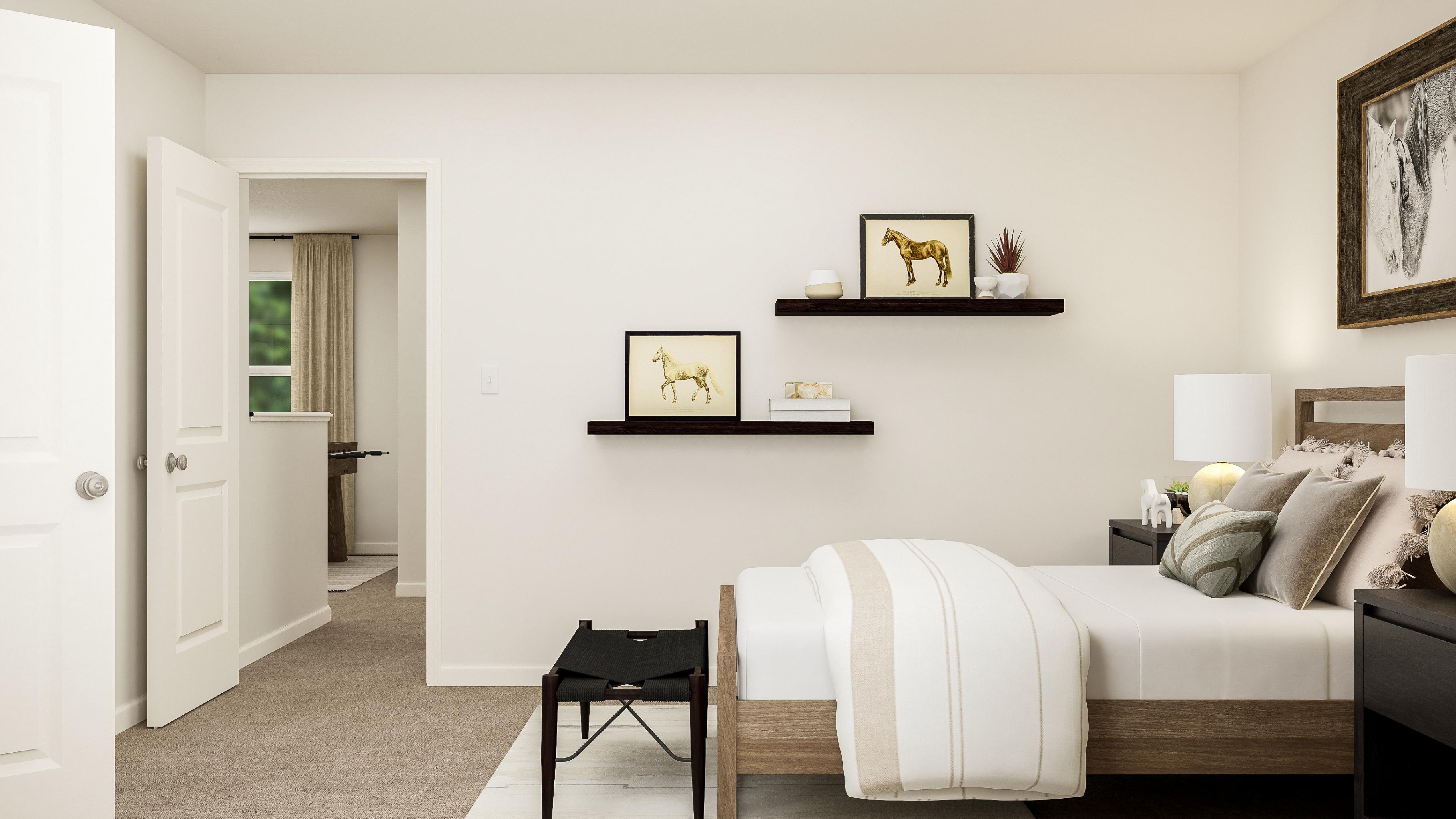 A bedroom with a bed and a chair.